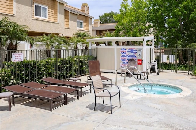 290 Victoria St Unit 19, Costa Mesa, CA 92627 - view of pool featuring a community hot tub, fence, and a patio area