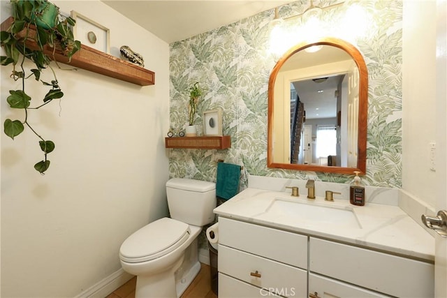 290 Victoria St Unit 19, Costa Mesa, CA 92627 - half bath with wallpapered walls, toilet, and vanity