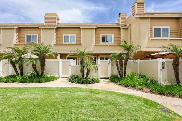 290 Victoria St Unit 19, Costa Mesa, CA 92627 - multi unit property featuring a gate, a chimney, and stucco siding