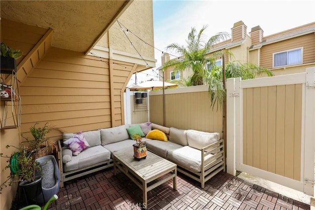 290 Victoria St Unit 19, Costa Mesa, CA 92627 - view of patio featuring an outdoor living space, fence, and a gate