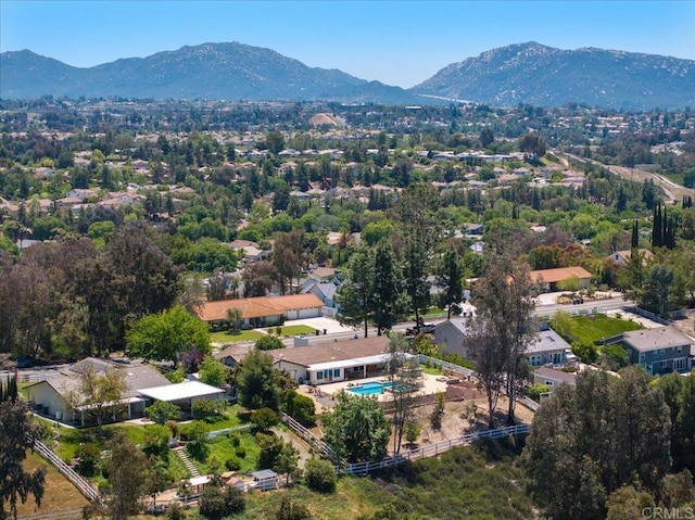 aerial view of mountains and a pool area