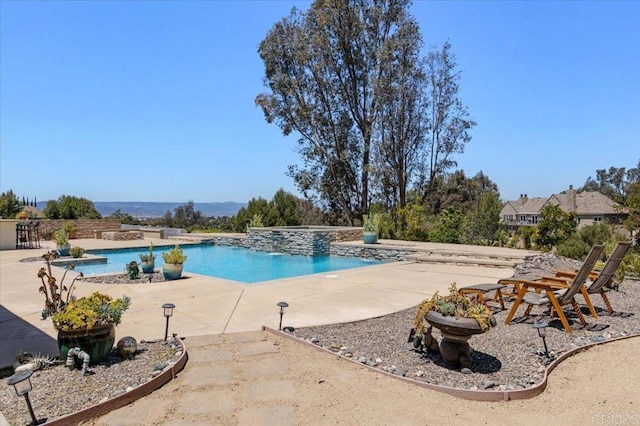 outdoor pool with a patio