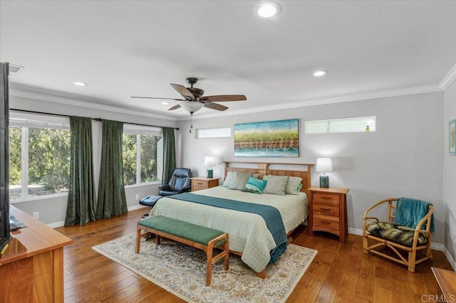 bedroom with baseboards, crown molding, hardwood / wood-style flooring, recessed lighting, and ceiling fan
