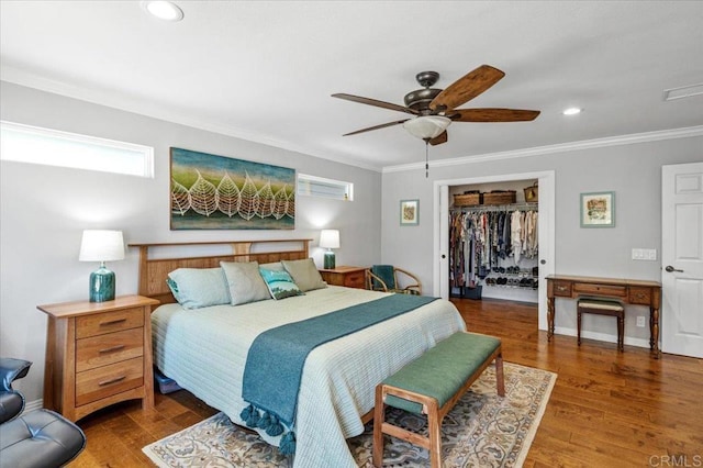 bedroom featuring crown molding, recessed lighting, wood finished floors, a closet, and ceiling fan