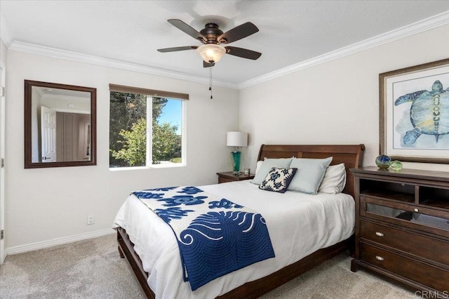 bedroom featuring light carpet, ornamental molding, baseboards, and ceiling fan