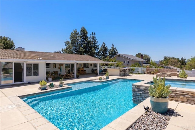 swimming pool with a patio area