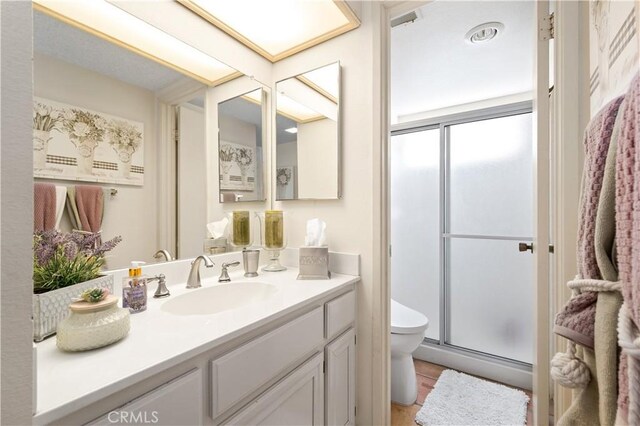 77178 Pauma Valley Way, Palm Desert, CA 92211 - bathroom with a shower stall, toilet, and vanity