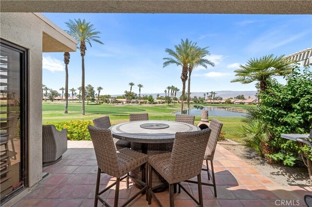77178 Pauma Valley Way, Palm Desert, CA 92211 - view of patio / terrace with outdoor dining area, a water view, and golf course view
