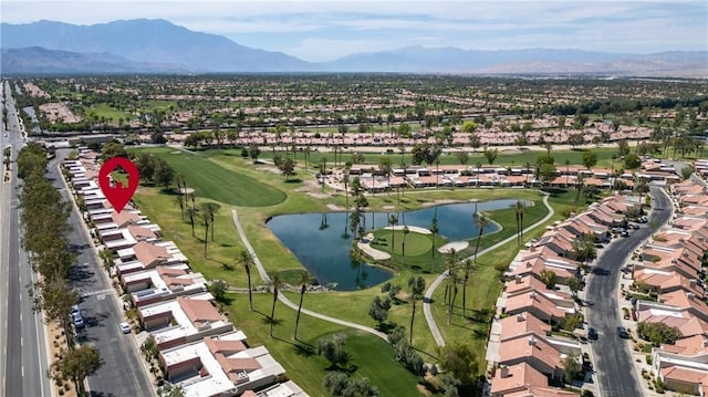 77178 Pauma Valley Way, Palm Desert, CA 92211 - aerial overview of property's location with nearby suburban area, a golf course, and a water and mountain view