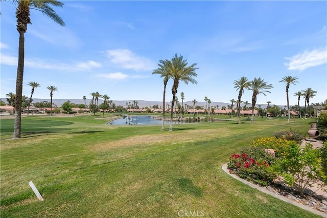 77178 Pauma Valley Way, Palm Desert, CA 92211 - view of home's community with a water and mountain view, a yard, and view of golf course