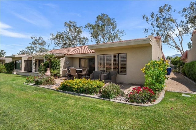 77178 Pauma Valley Way, Palm Desert, CA 92211 - rear view of house with stucco siding, a tile roof, a yard, and a patio area