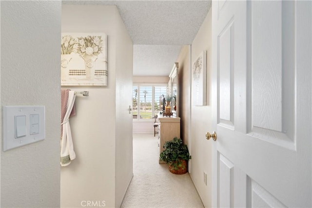 77178 Pauma Valley Way, Palm Desert, CA 92211 - hall featuring a textured ceiling and carpet