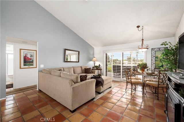 77178 Pauma Valley Way, Palm Desert, CA 92211 - living area with high vaulted ceiling and light tile patterned flooring