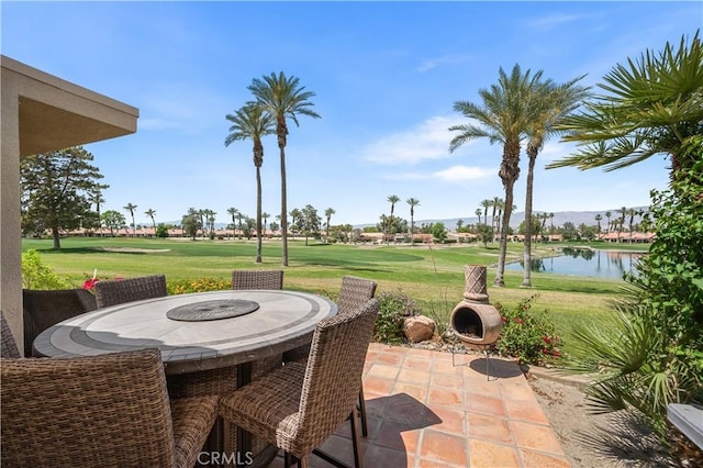 77178 Pauma Valley Way, Palm Desert, CA 92211 - view of patio / terrace featuring golf course view, a water view, and outdoor dining area