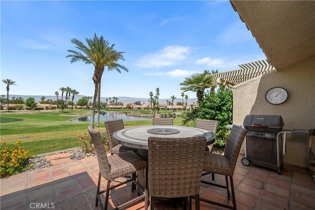 77178 Pauma Valley Way, Palm Desert, CA 92211 - view of patio / terrace with outdoor dining space, a water and mountain view, and a grill