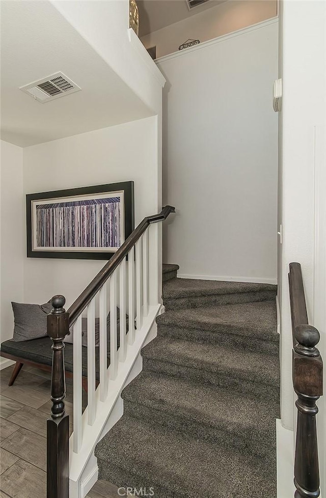 7005 N Astoria Dr, Fresno, CA 93722 - stairs featuring baseboards