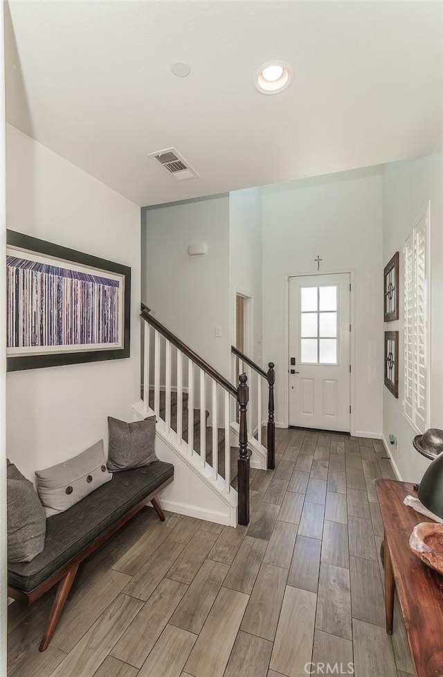 7005 N Astoria Dr, Fresno, CA 93722 - entrance foyer with wood finished floors, stairs, baseboards, and recessed lighting
