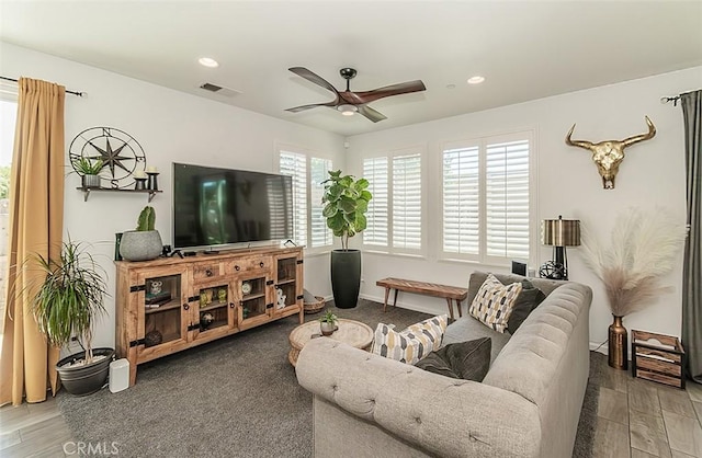 7005 N Astoria Dr, Fresno, CA 93722 - living area featuring a ceiling fan, wood finished floors, and recessed lighting