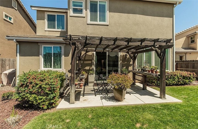 7005 N Astoria Dr, Fresno, CA 93722 - rear view of property featuring a pergola, stucco siding, and a patio
