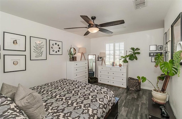 7005 N Astoria Dr, Fresno, CA 93722 - bedroom featuring dark wood-type flooring, baseboards, and a ceiling fan