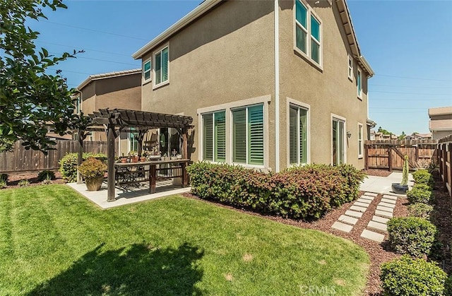 7005 N Astoria Dr, Fresno, CA 93722 - rear view of house featuring a pergola, a patio, and stucco siding