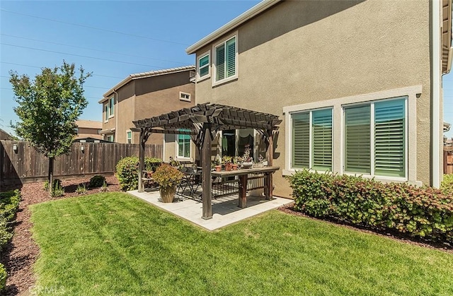 7005 N Astoria Dr, Fresno, CA 93722 - back of house with a pergola, stucco siding, and a patio