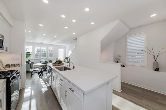 16436 Whittier Blvd Unit 1, Whittier, CA 90603 - kitchen featuring stainless steel appliances, a sink, white cabinetry, recessed lighting, and wood finished floors