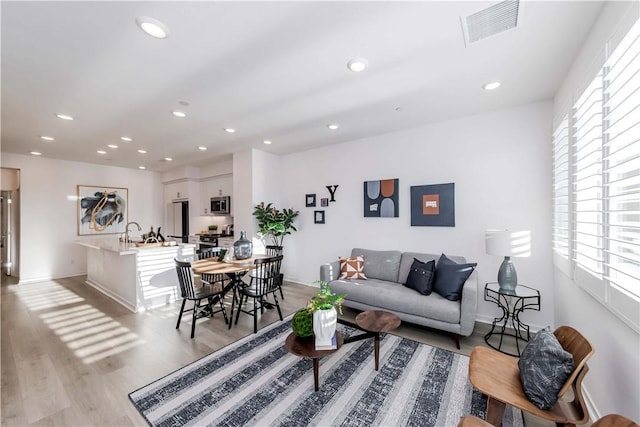 16436 Whittier Blvd Unit 1, Whittier, CA 90603 - living room with light wood-style flooring, recessed lighting, and baseboards