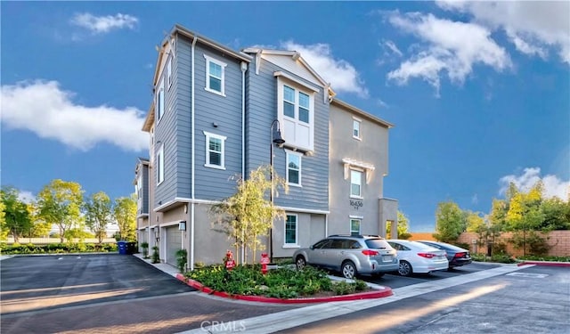 16436 Whittier Blvd Unit 1, Whittier, CA 90603 - view of front of house featuring uncovered parking and stucco siding