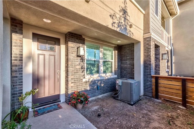 16436 Whittier Blvd Unit 1, Whittier, CA 90603 - entrance to property featuring brick siding, cooling unit, and a porch