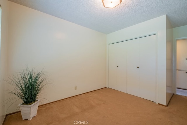 655 Fountain Springs Ln, Glendora, CA 91741 - unfurnished bedroom featuring light colored carpet, a closet, and a textured ceiling