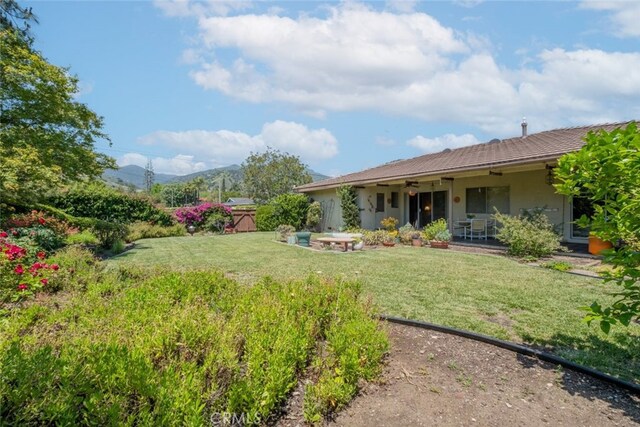 655 Fountain Springs Ln, Glendora, CA 91741 - view of grassy yard with a patio area, a ceiling fan, and a mountain view