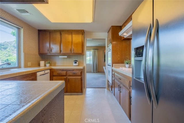 655 Fountain Springs Ln, Glendora, CA 91741 - kitchen featuring white appliances, a sink, tile countertops, brown cabinetry, and plenty of natural light