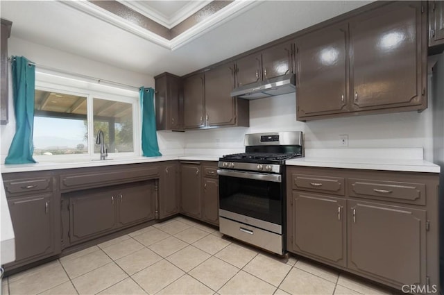 8140 Weirick Rd, Corona, CA 92883 - kitchen with stainless steel gas range, under cabinet range hood, a sink, light countertops, and crown molding