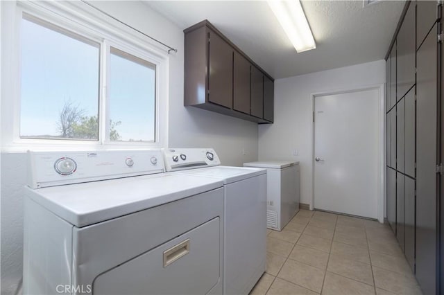 8140 Weirick Rd, Corona, CA 92883 - clothes washing area with independent washer and dryer, light tile patterned floors, and cabinet space