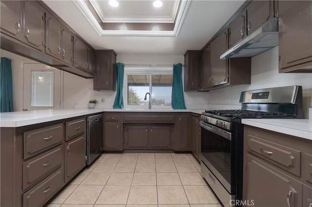 8140 Weirick Rd, Corona, CA 92883 - kitchen with stainless steel appliances, under cabinet range hood, a raised ceiling, crown molding, and light countertops