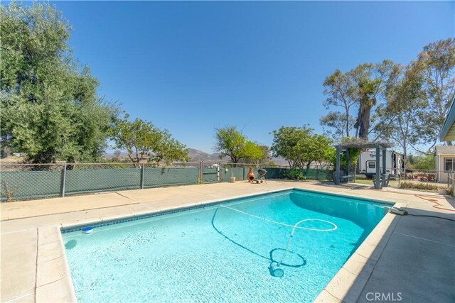 8140 Weirick Rd, Corona, CA 92883 - view of pool featuring fence and a patio area
