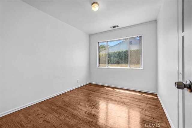 6225 Langdon Ave, Van Nuys, CA 91411 - unfurnished room featuring wood finished floors and baseboards