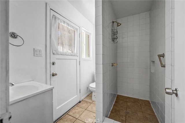 6225 Langdon Ave, Van Nuys, CA 91411 - bathroom featuring tiled shower, toilet, tile patterned flooring, and vanity