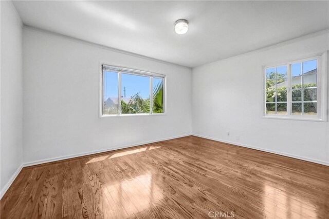 6225 Langdon Ave, Van Nuys, CA 91411 - spare room featuring wood finished floors and baseboards