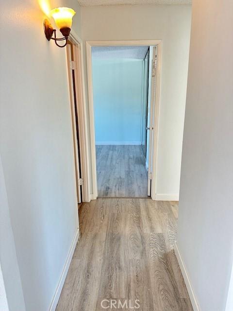 42815 Warner Trl, Palm Desert, CA 92211 - hall featuring wood finished floors and baseboards