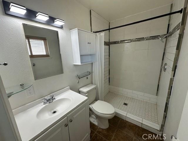 42815 Warner Trl, Palm Desert, CA 92211 - full bath with toilet, a shower stall, vanity, and tile patterned floors