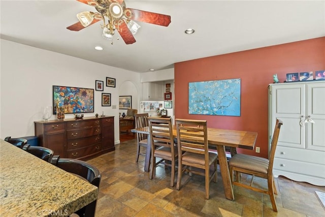 3123 Michael Way, Chico, CA 95973 - dining space featuring a ceiling fan, arched walkways, stone tile floors, and recessed lighting