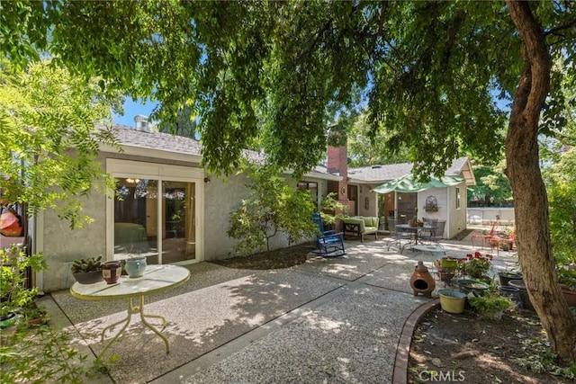 3123 Michael Way, Chico, CA 95973 - back of property featuring stucco siding and a patio