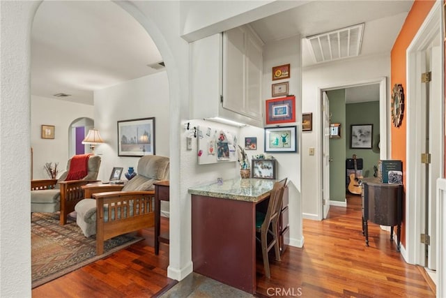 3123 Michael Way, Chico, CA 95973 - bar area featuring arched walkways, wood finished floors, and baseboards