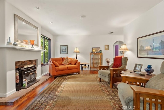3123 Michael Way, Chico, CA 95973 - living room with wood finished floors, arched walkways, baseboards, and a fireplace