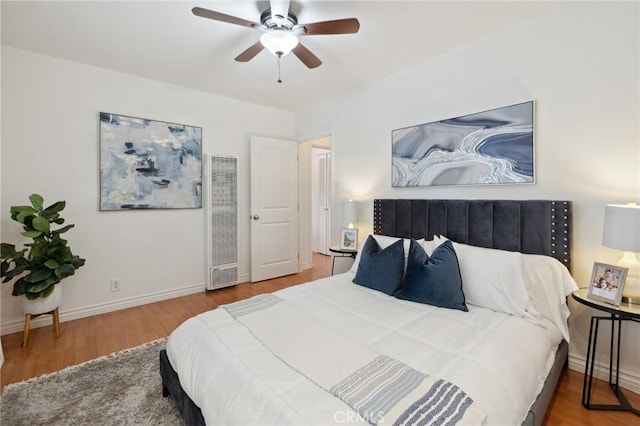 10708 Sable Ave, Sunland, CA 91040 - bedroom featuring a heating unit, wood finished floors, baseboards, and a ceiling fan