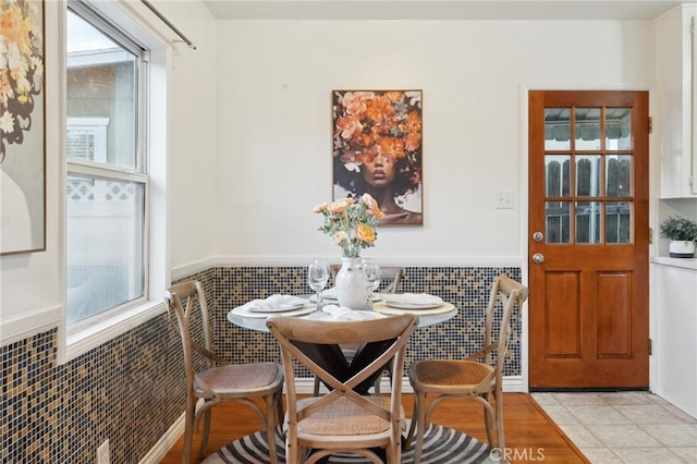 10708 Sable Ave, Sunland, CA 91040 - dining area featuring plenty of natural light, a wainscoted wall, and tile walls