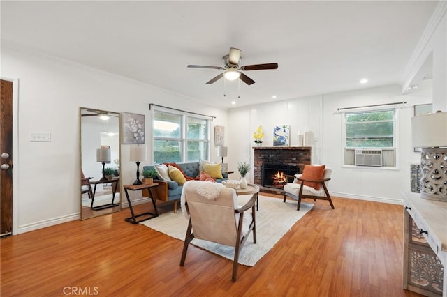 10708 Sable Ave, Sunland, CA 91040 - living area featuring a ceiling fan, a brick fireplace, healthy amount of natural light, light wood finished floors, and crown molding