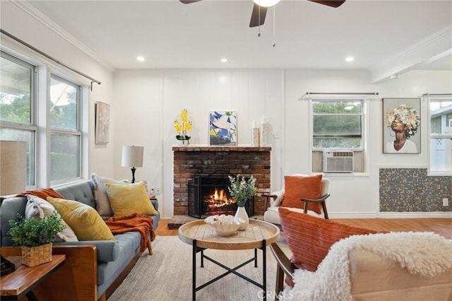 10708 Sable Ave, Sunland, CA 91040 - living area featuring wood finished floors, a brick fireplace, healthy amount of natural light, recessed lighting, and ornamental molding